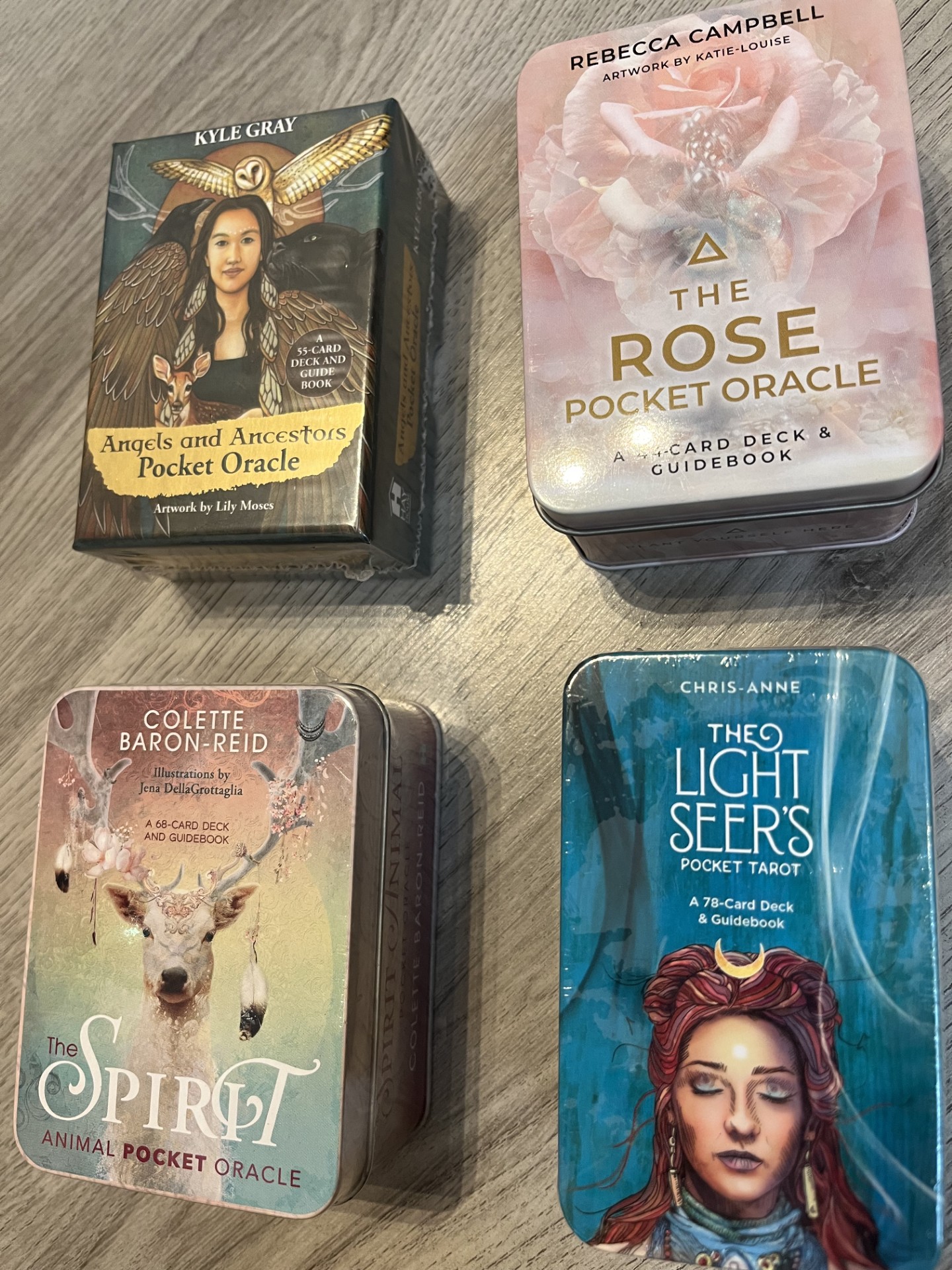 Pocket oracle and tarot decks available to browse in the shop